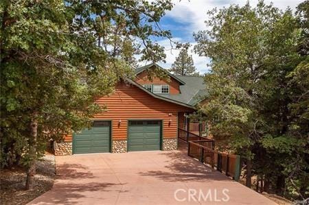 log home with a garage