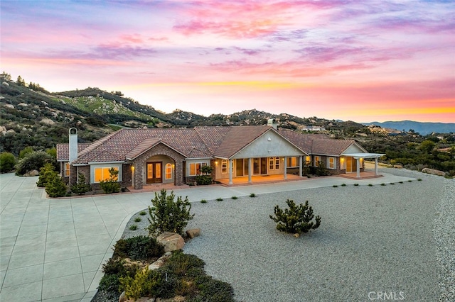 ranch-style home with a mountain view