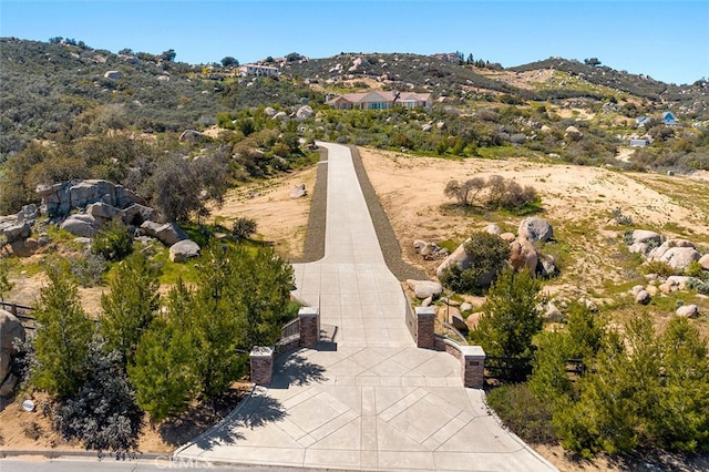 drone / aerial view featuring a mountain view