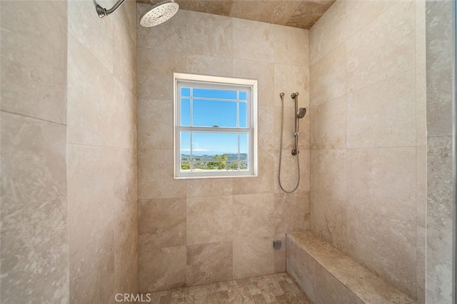 bathroom with tiled shower