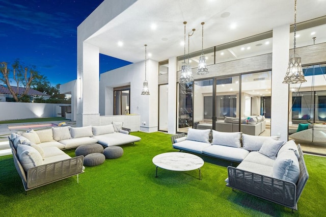 interior space with outdoor lounge area and a yard