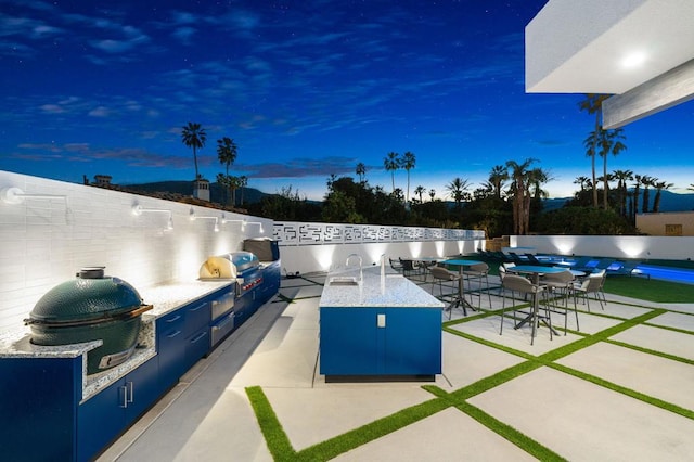 patio terrace at dusk with grilling area