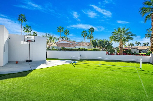 exterior space featuring tennis court