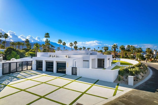 rear view of property with a garage