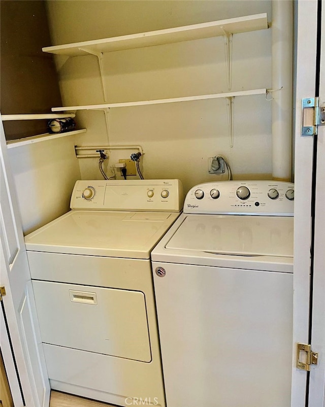 laundry room featuring washing machine and clothes dryer