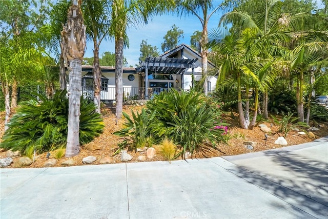 view of front of property with a pergola