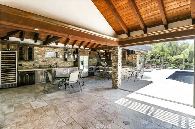 view of patio with wine cooler and an outdoor bar