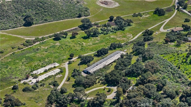 birds eye view of property with a rural view