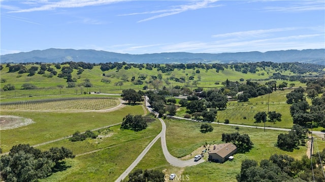 drone / aerial view featuring a mountain view and a rural view