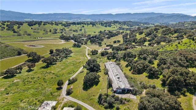 drone / aerial view featuring a rural view and a mountain view