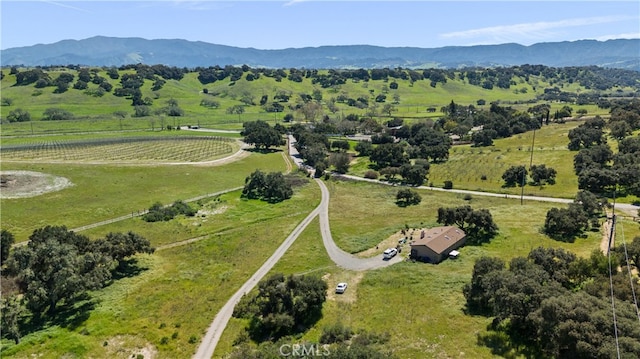 birds eye view of property with a mountain view and a rural view