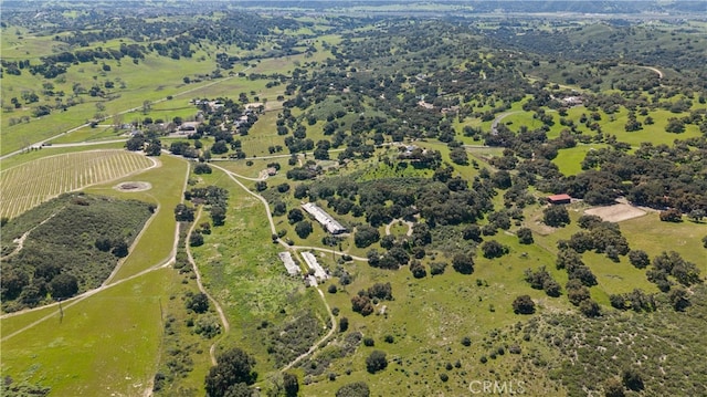 birds eye view of property with a rural view