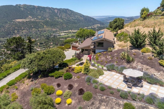 birds eye view of property with a mountain view