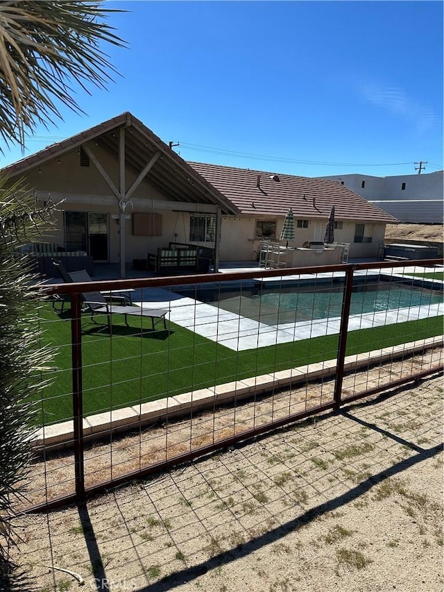 view of swimming pool featuring a patio area