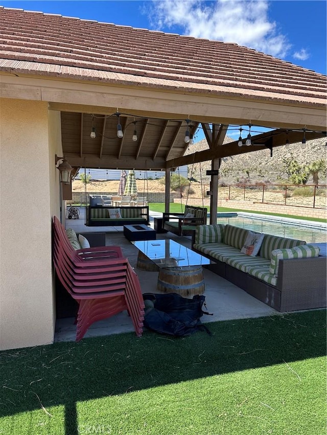 view of patio / terrace with outdoor lounge area and ceiling fan