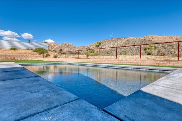 view of pool with a mountain view