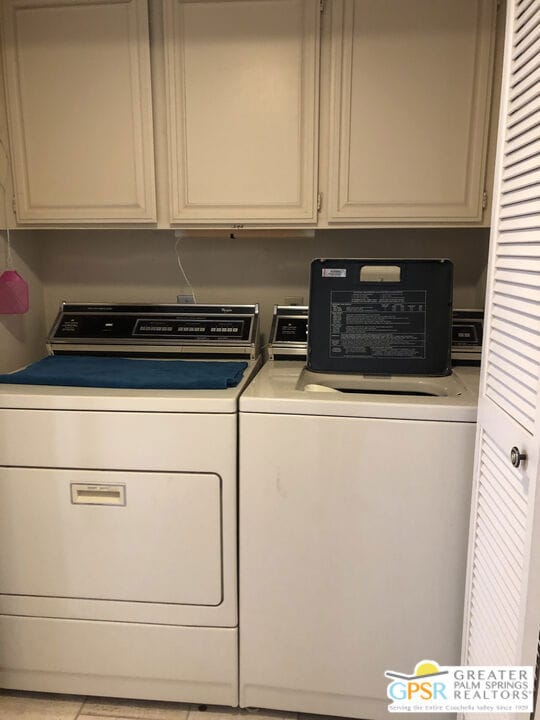 washroom featuring independent washer and dryer