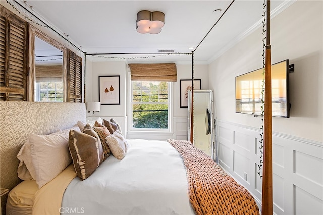 bedroom with crown molding