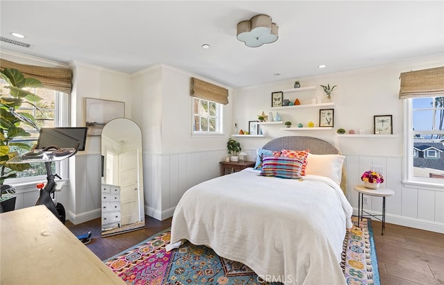 bedroom featuring ornamental molding and dark hardwood / wood-style floors