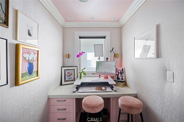 home office with built in desk and crown molding