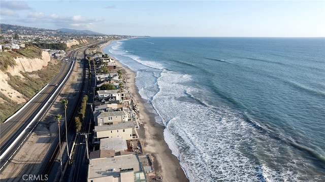 bird's eye view with a view of the beach and a water view