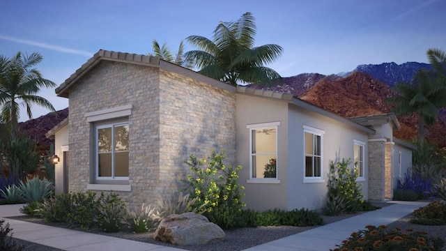 view of side of home featuring a mountain view