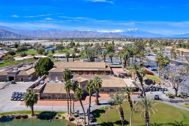 birds eye view of property with a mountain view