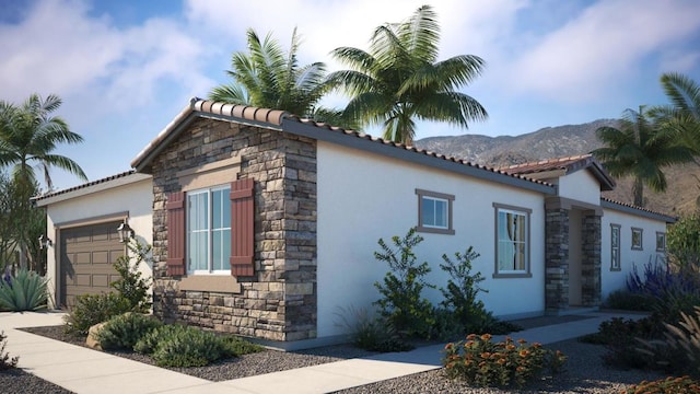 view of home's exterior featuring a mountain view and a garage