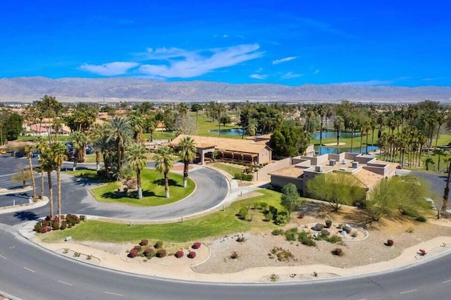 birds eye view of property with a mountain view