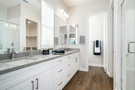 bathroom with vanity and wood-type flooring