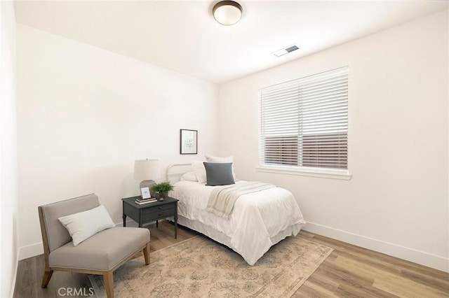 bedroom featuring wood-type flooring