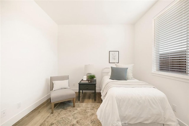 bedroom with light hardwood / wood-style flooring