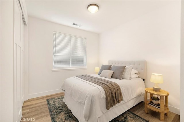 bedroom with light wood-type flooring