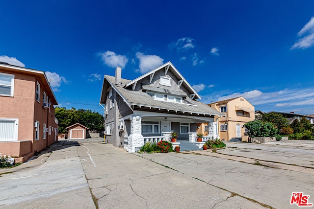 view of front facade featuring a storage unit