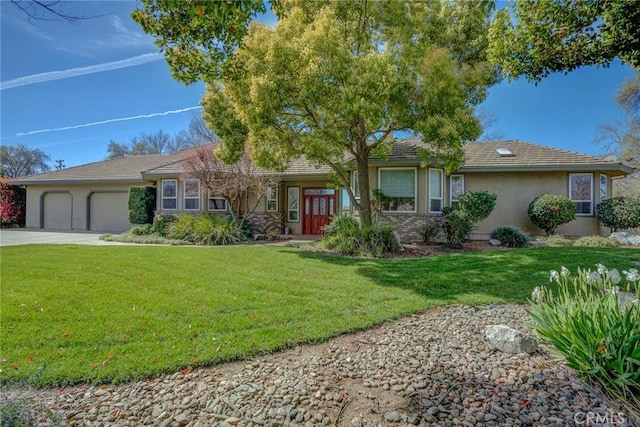 ranch-style house with a garage and a front lawn