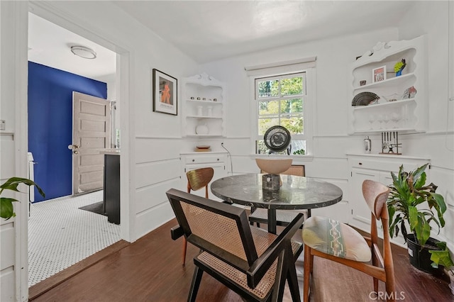 dining space with dark wood-type flooring