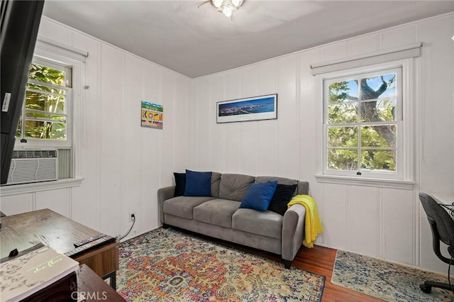 living room featuring cooling unit and wood-type flooring