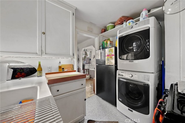 laundry room featuring stacked washing maching and dryer