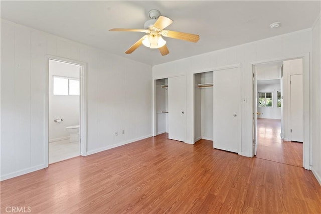 unfurnished bedroom with ceiling fan, light hardwood / wood-style floors, and multiple windows