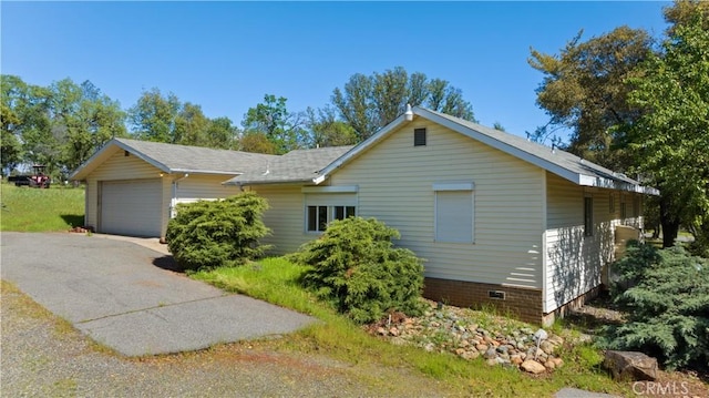 view of side of property featuring a garage