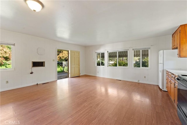 unfurnished living room with light wood-type flooring