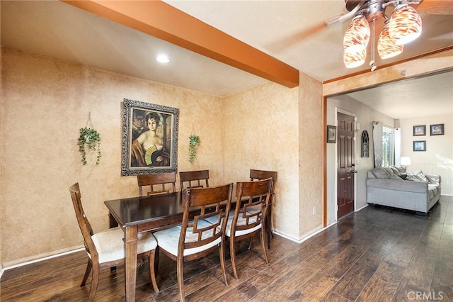 dining area with beam ceiling, ceiling fan, and dark hardwood / wood-style floors