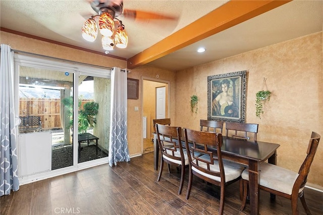 dining area featuring beamed ceiling, ceiling fan, and dark wood-type flooring