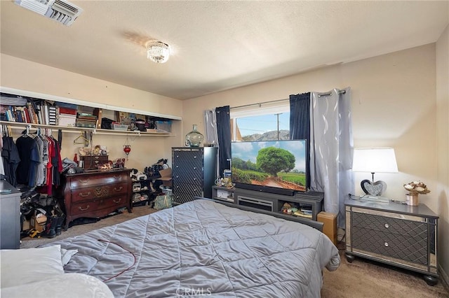 carpeted bedroom featuring a closet