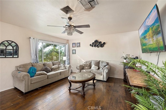 living room with dark hardwood / wood-style floors and ceiling fan