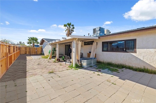 rear view of house featuring a patio area and central air condition unit