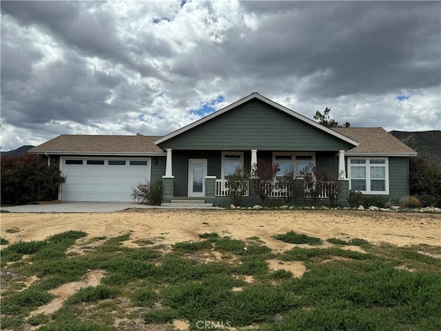 view of front of property with a garage and covered porch