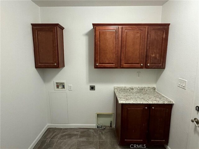 laundry area featuring cabinets, washer hookup, and electric dryer hookup