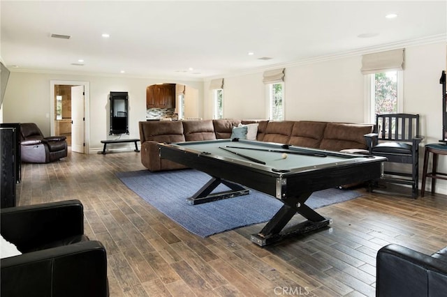 rec room with ornamental molding, dark wood-type flooring, and pool table