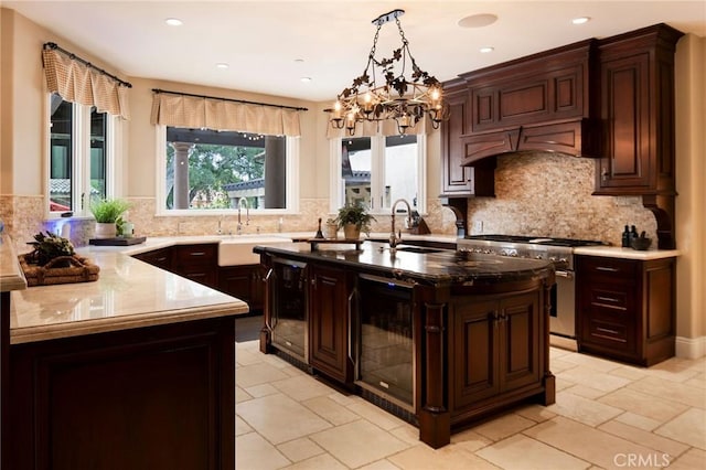 kitchen featuring wine cooler, high end stainless steel range, and sink